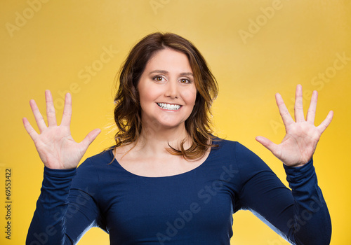 Woman making two times five sign gesture hands, fingers photo