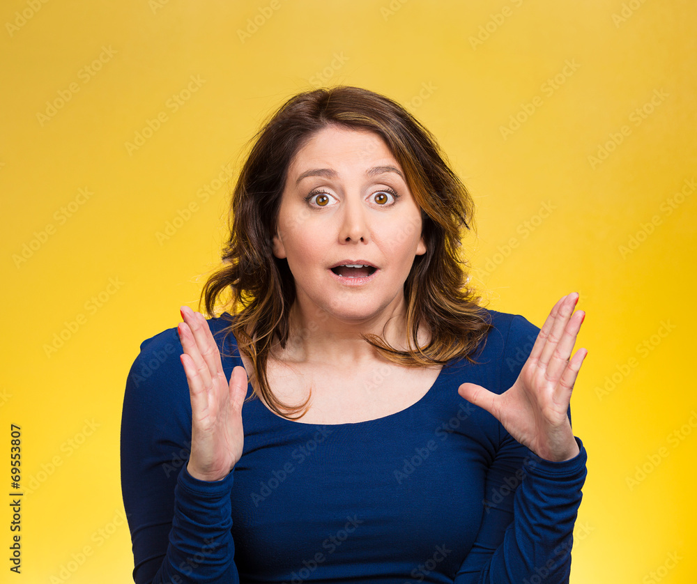 Startled woman, looking shocked, surprised on yellow background Startled woman, looking shocked, surprised on yellow background