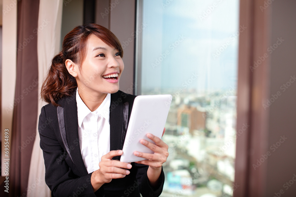 Young business woman using tablet pc