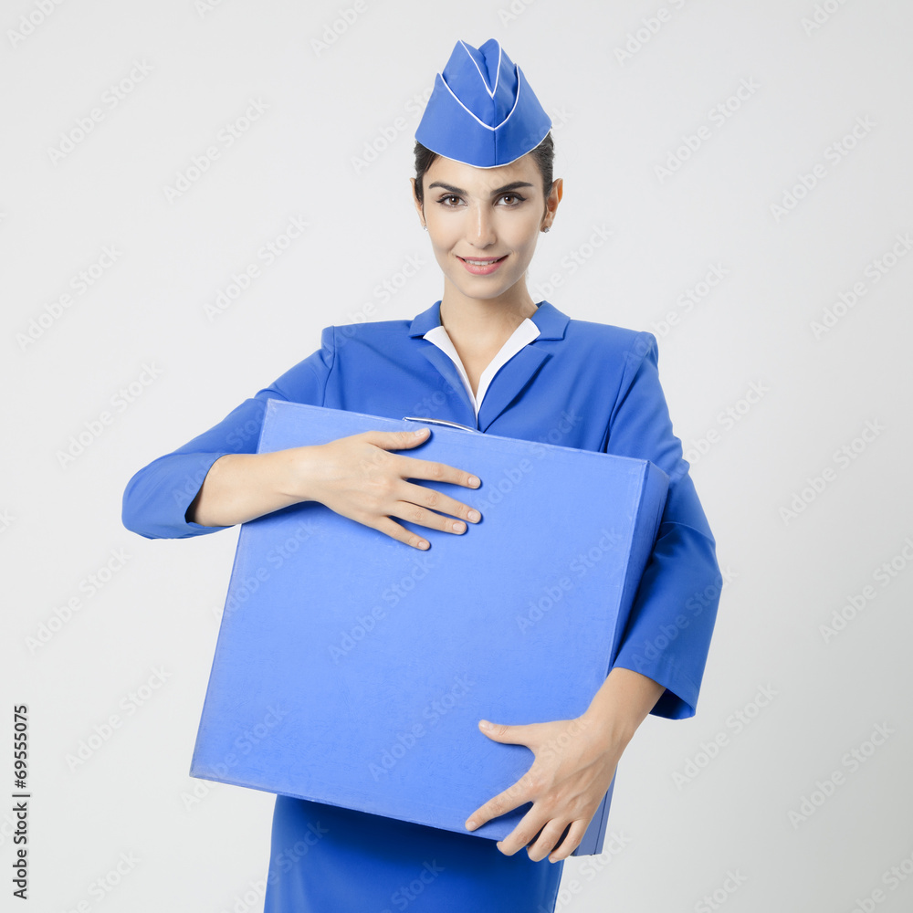 Charming Stewardess Dressed In Blue Uniform And Suitcase Charming Stewardess Dressed In Blue Uniform And Suitcase
