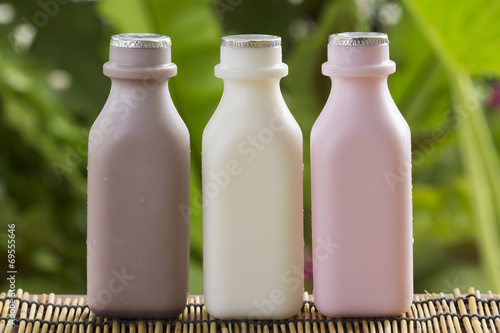 Strawberry, chocolate and fresh milk bottles
