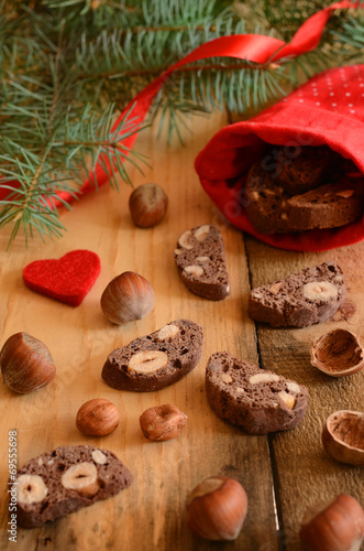 Xmas decoration with chocolate biscotti and pine twigs