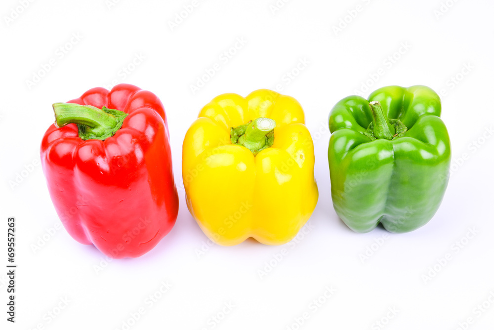 red, green and yellow paprika on a white screen red, green and yellow paprika on a white screen