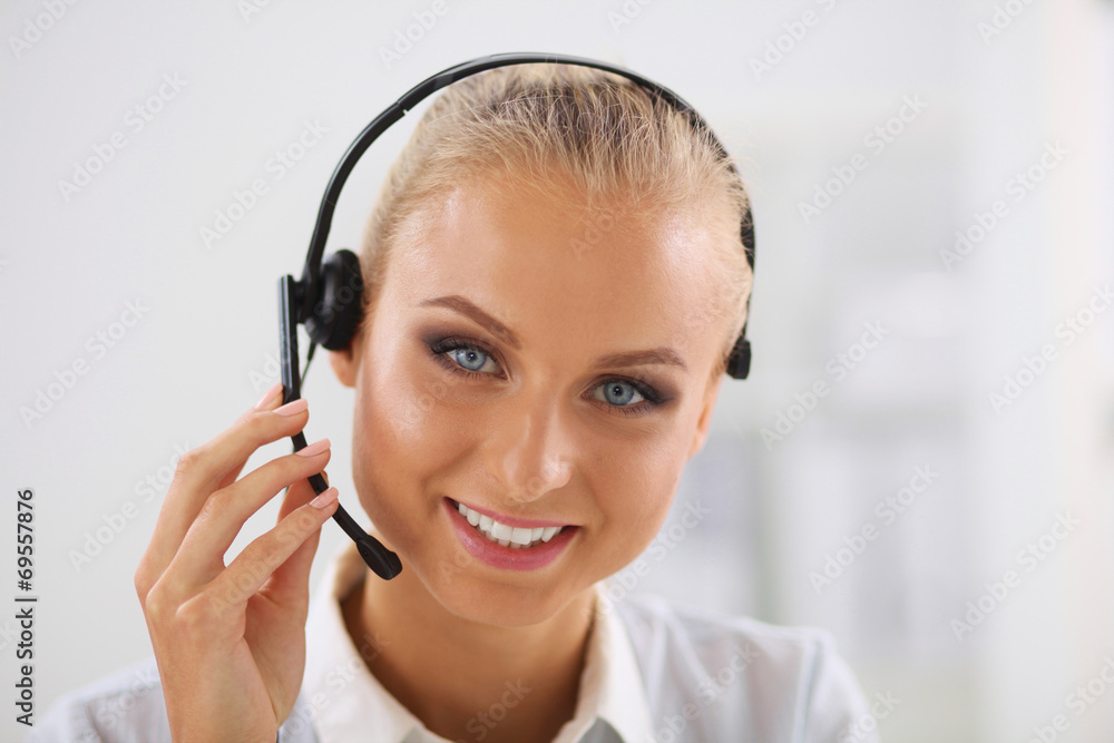 Close-up portrait of a customer service agent sitting at office Close-up portrait of a customer service agent sitting at office