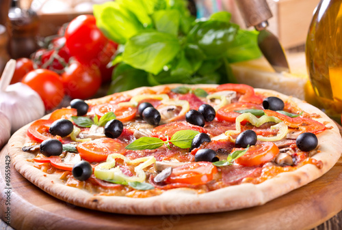 pizza with bacon, vegetables and olives