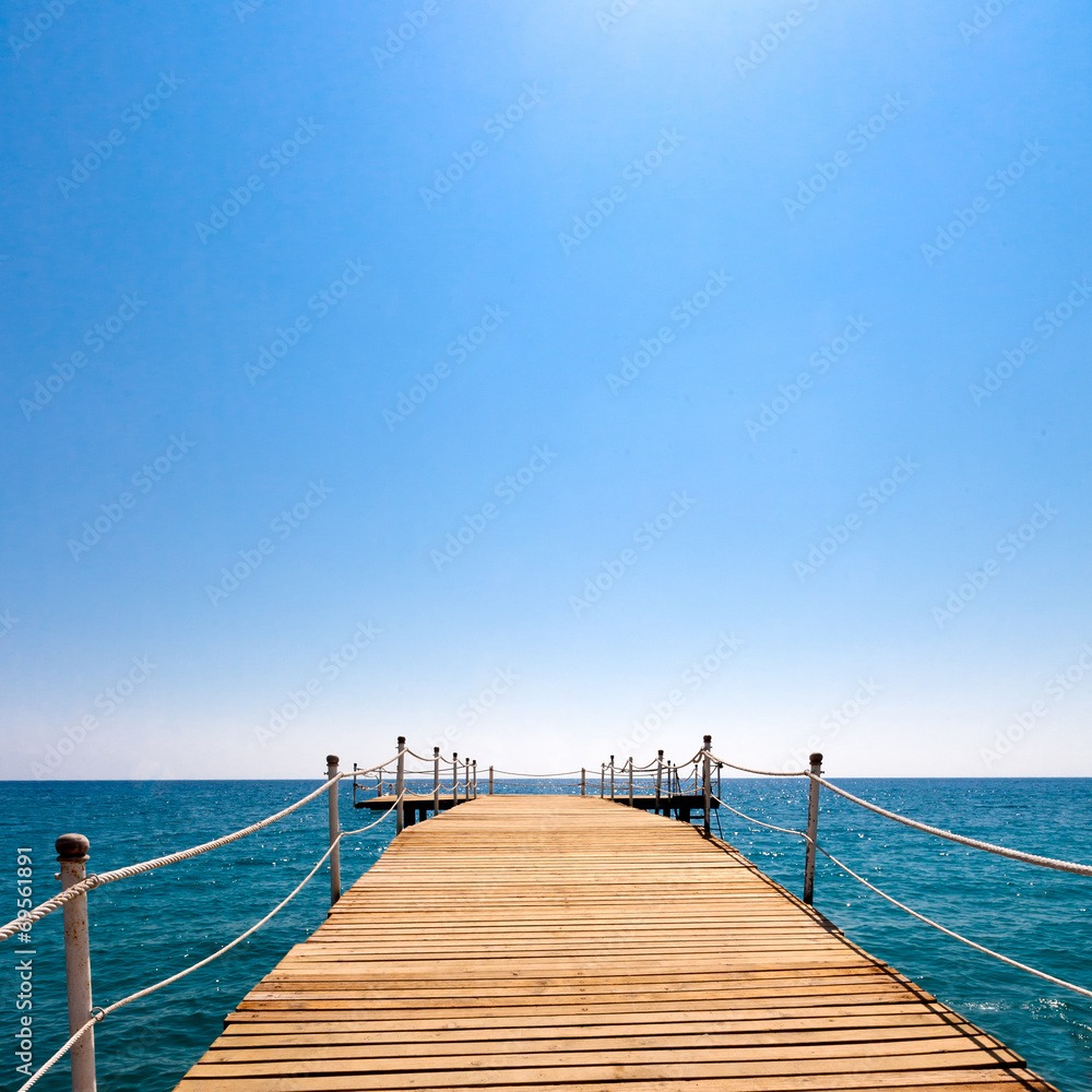 Fototapeta premium Pier in the sea and blue sky