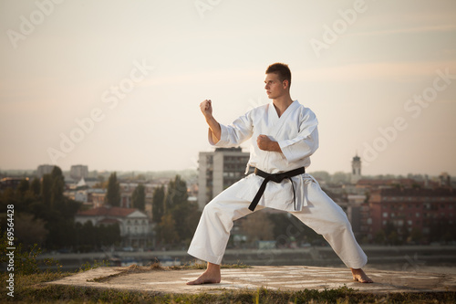 Man practicing martial arts outdoors