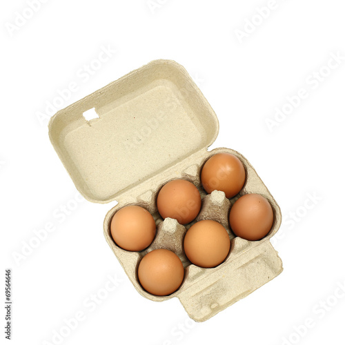 Six brown eggs in a carton package isolated with clipping path