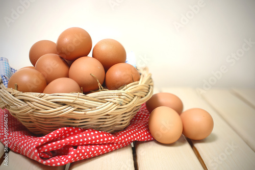 Eggs in a basket on wodden table