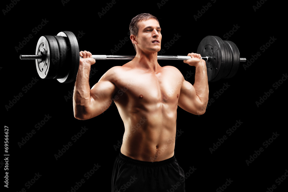 Weightlifting athlete lifting a barbell Weightlifting athlete lifting a barbell