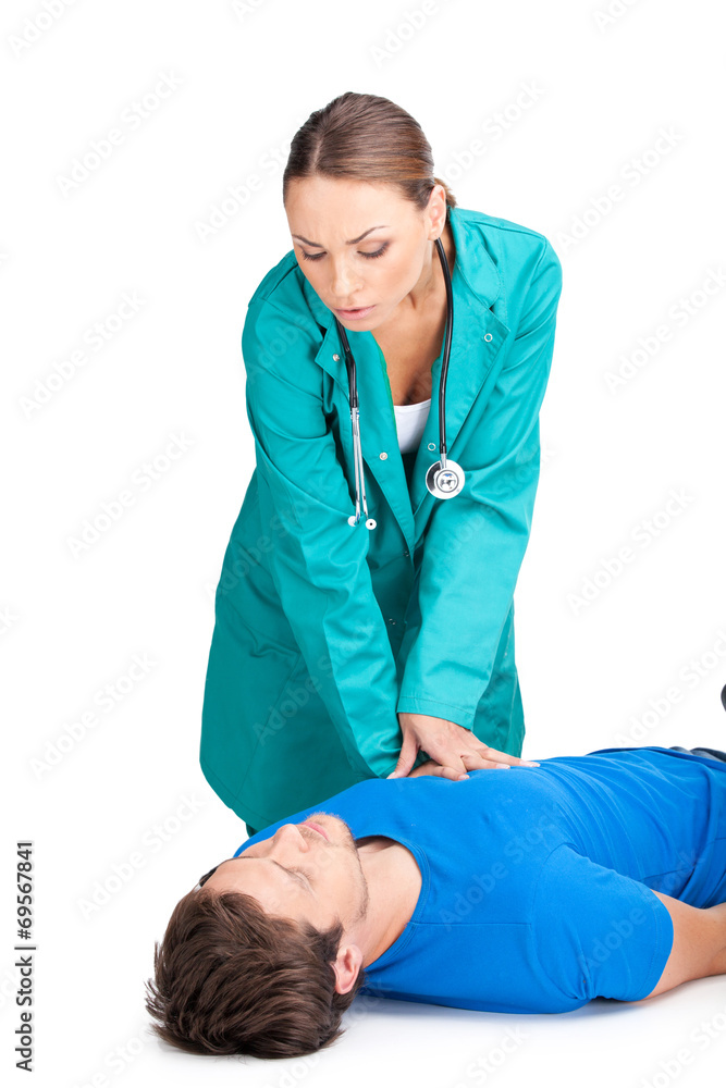 doctor giving cardiopulmonary resuscitation to man. doctor giving cardiopulmonary resuscitation to man.