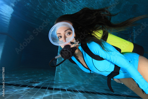 Fototapeta Female scuba diver underwater