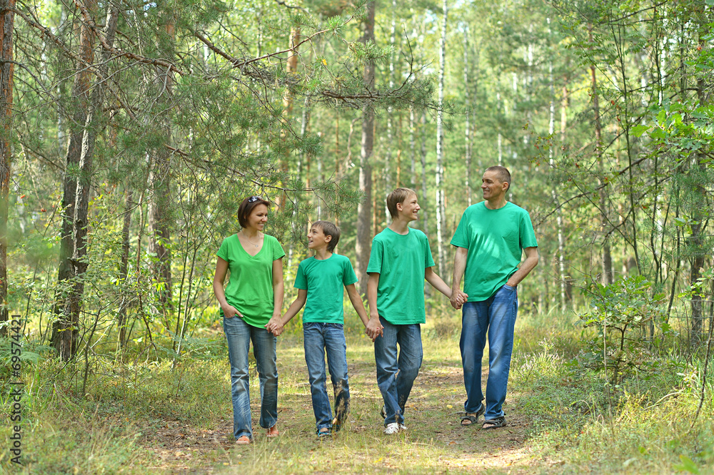 Cheerful family in green shirts