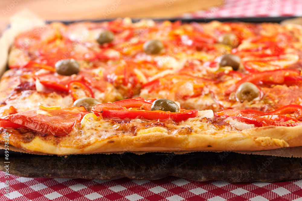 Classic homemade pizza served on paper