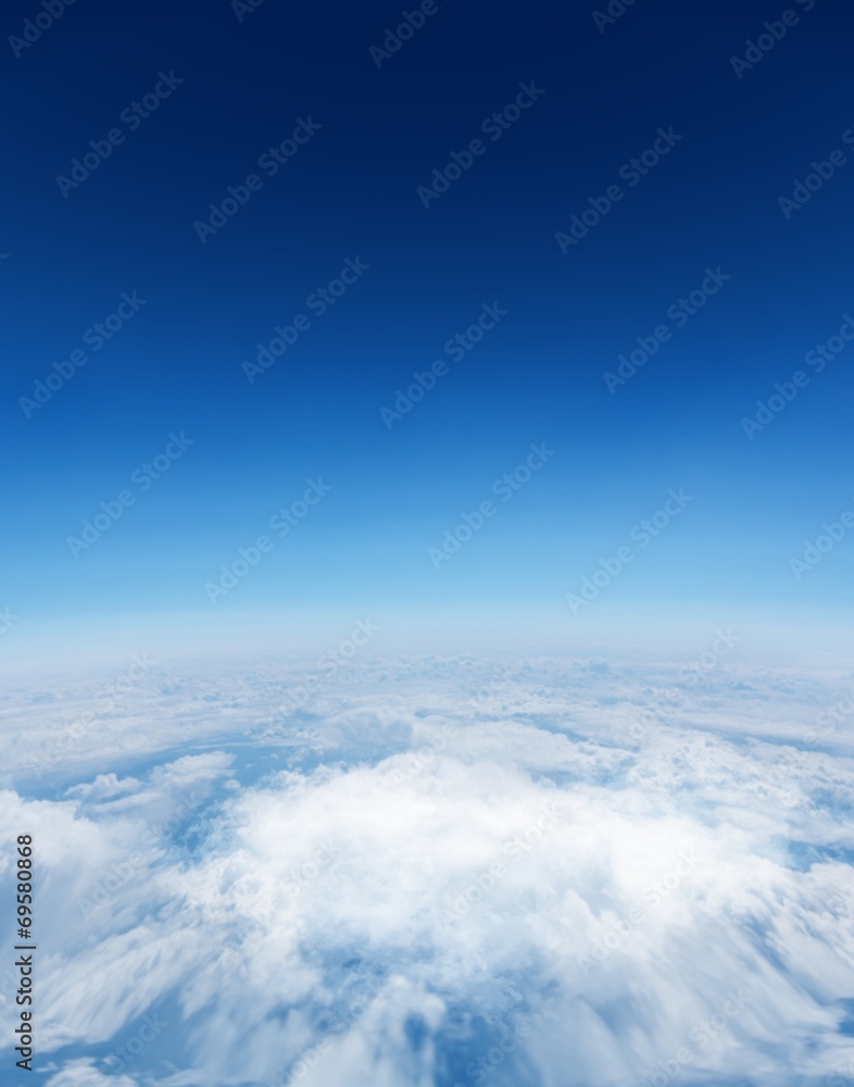 Digitally generated graphic Blue sky over white clouds