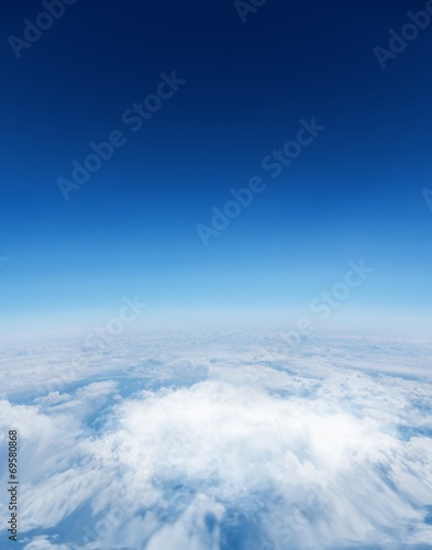 Digitally generated graphic Blue sky over white clouds