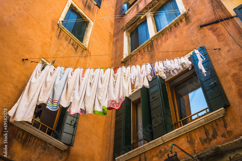 Underwear drying on the rope in the old yard © Oleg Zhukov