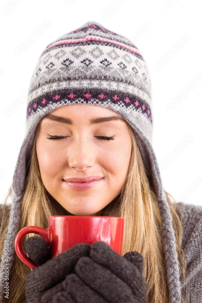 Happy blonde in winter clothes holding mug Happy blonde in winter clothes holding mug