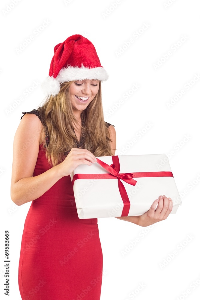 Festive blonde opening a gift Festive blonde opening a gift