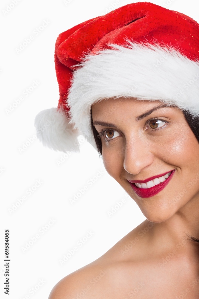 Fototapeta premium Smiling woman wearing santa hat