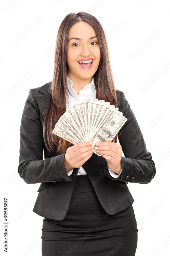 Delighted businesswoman holding a stack of money Delighted businesswoman holding a stack of money