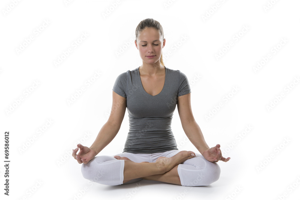 Attractive young woman meditating