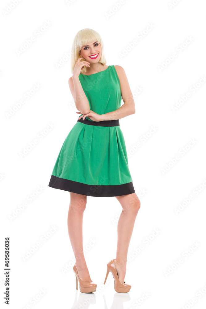 Elegance blonde girl in green dress