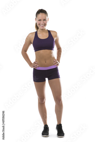 Fit muscular young woman in sportswear