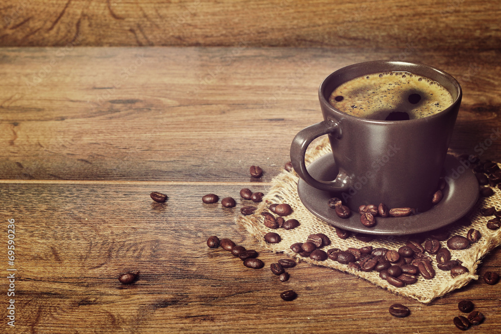 coffee served in a dark cup on wooden table on rustic style coffee served in a dark cup on wooden table on rustic style