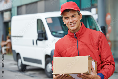 delivery man with package outdoors