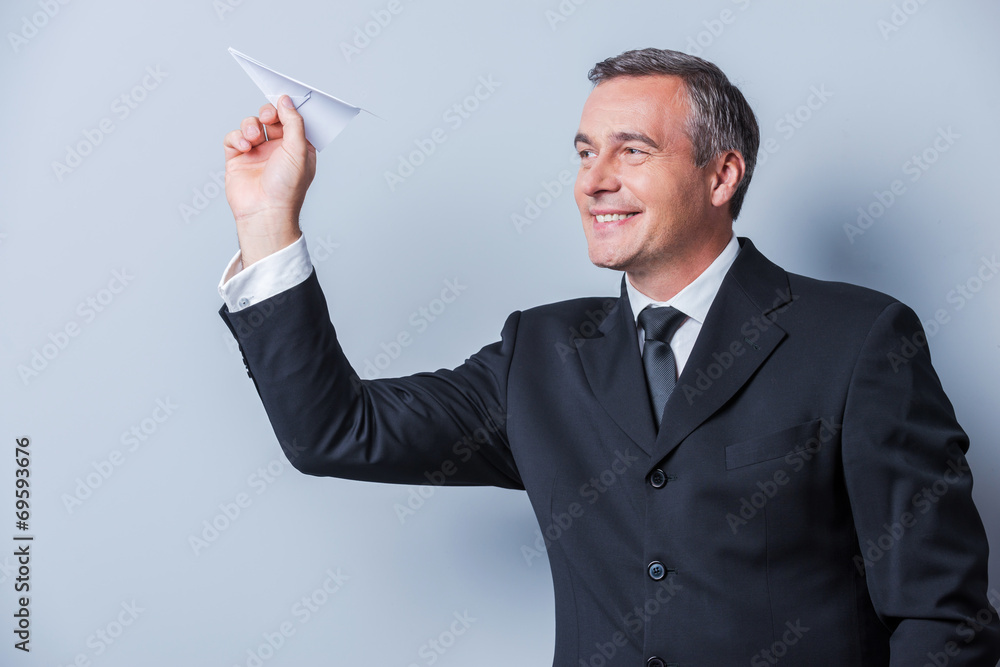 Businessman with paper airplane. Businessman with paper airplane.