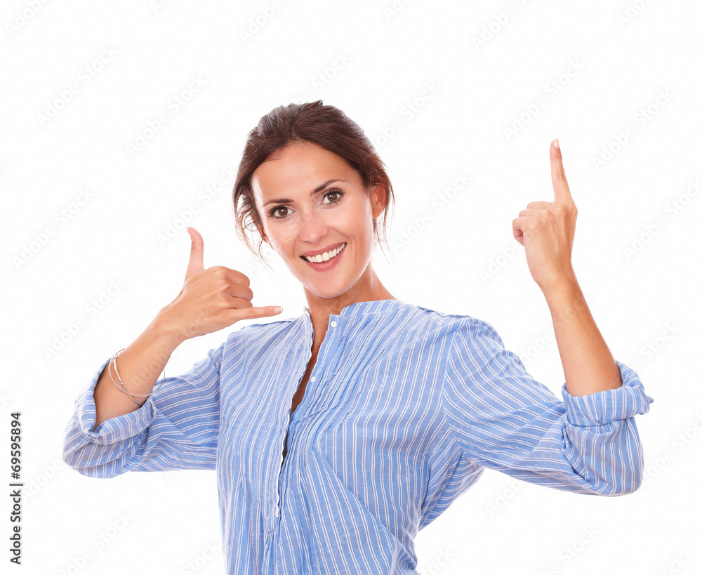 Charming adult lady with call gesture pointing up Charming adult lady with call gesture pointing up