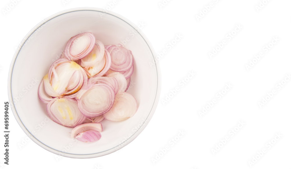 Chopped onions in a bowl over white background