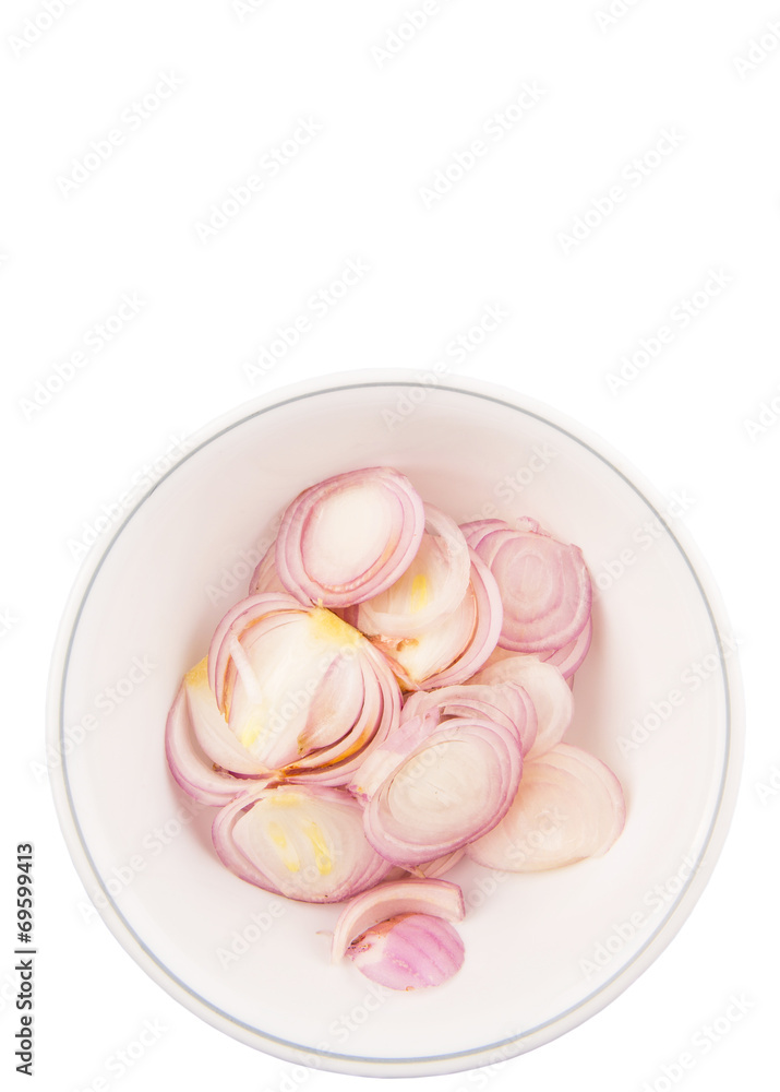Chopped onions in a bowl over white background