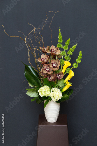 Floral arangement with Calla, cymbidium, Hydrangea, moluccella photo