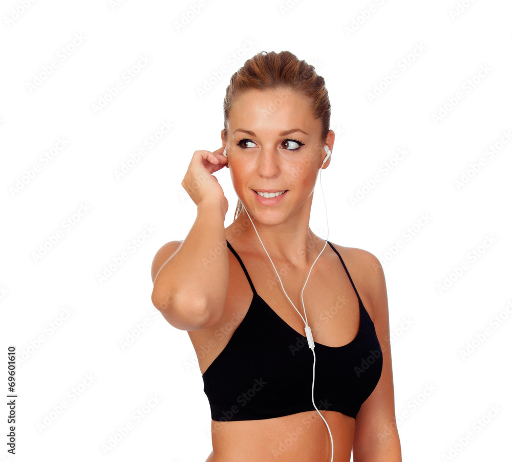 Pretty woman doing fitness istening music with headphones Pretty woman doing fitness istening music with headphones