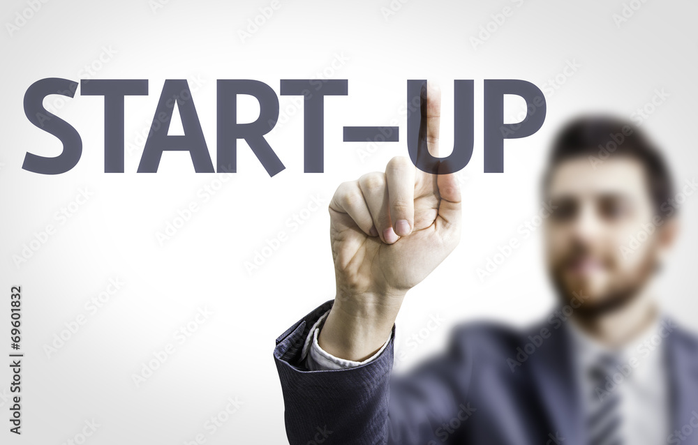 Business man pointing the text: Start-Up Business man pointing the text: Start-Up