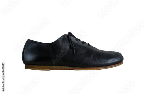 Side view of black leather shoes isolated on white