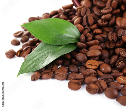 Coffee beans in big lilac bowl isolated on white