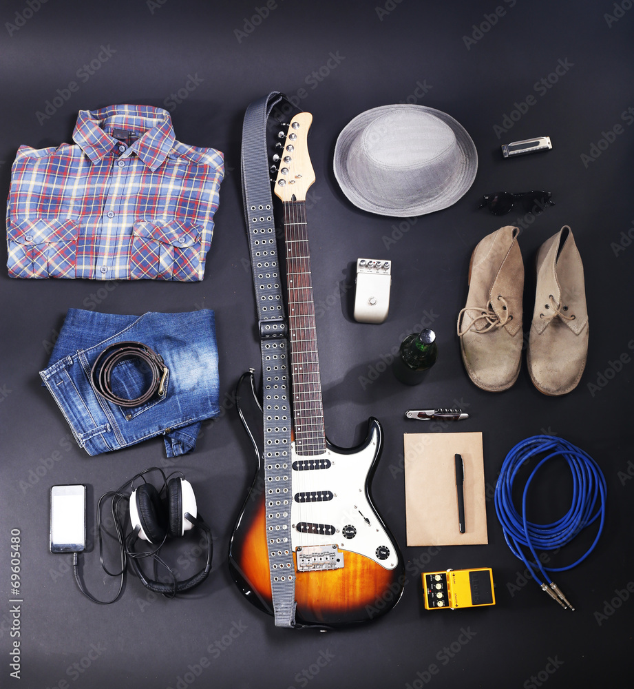 Musical equipment, clothes and footwear on dark background Musical equipment, clothes and footwear on dark background