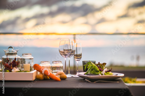 Empty glasses set in restaurant  Dinner table at sunset