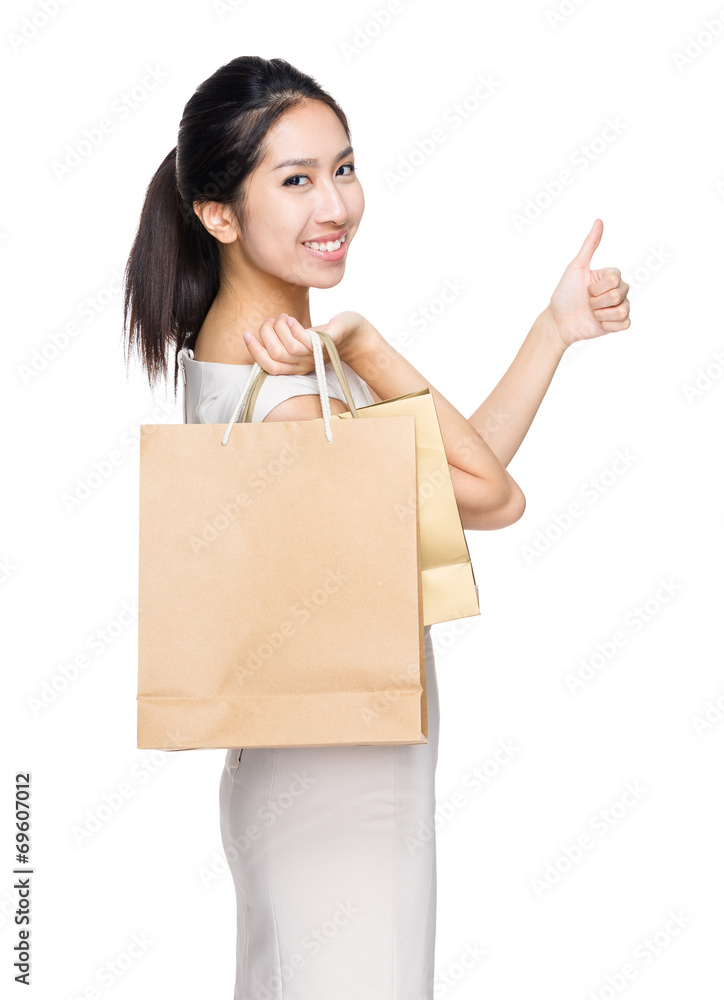 Woman hold with shopping bag and thumb up Woman hold with shopping bag and thumb up
