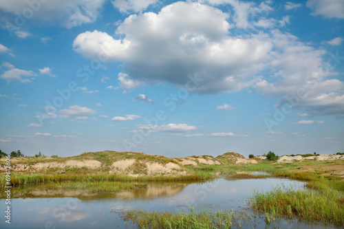 Marsh after sand excavation, landscape with beautiful sky