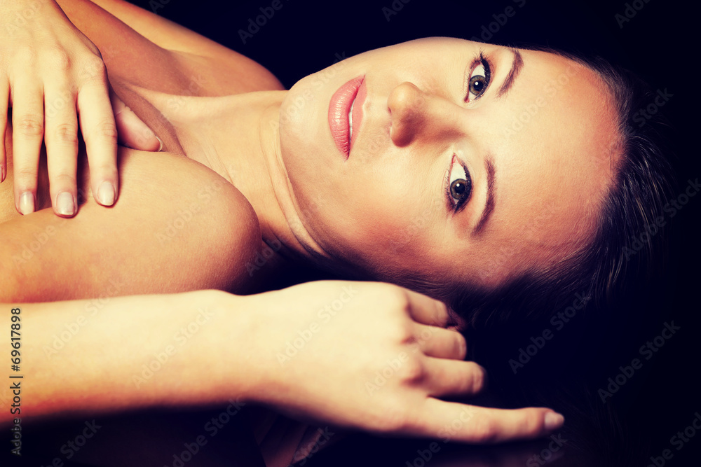 Portrait of a beautiful nude woman lying. Portrait of a beautiful nude woman lying.