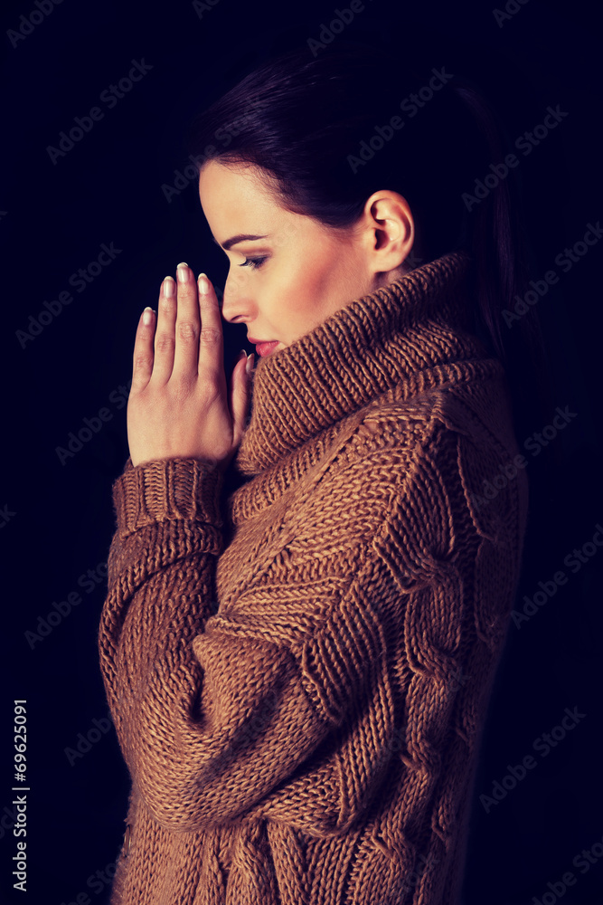 Young woman praying. Young woman praying.