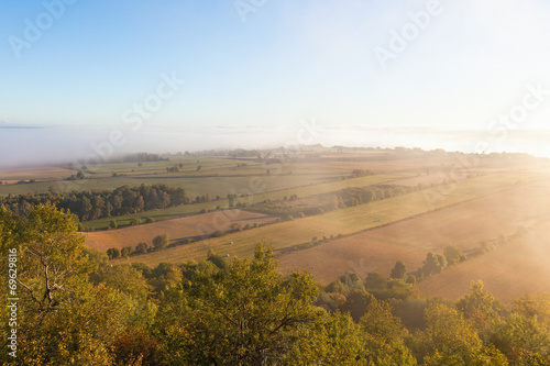 View of rural landscape in fog