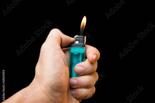 Hand with lighter igniting
