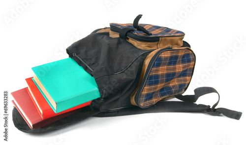 School backpack and books. On white background.