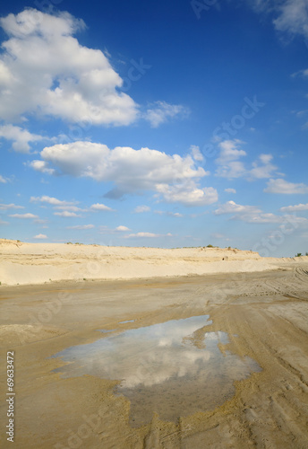 Sand quarry  heap of sand and puddle  beautiful landscape