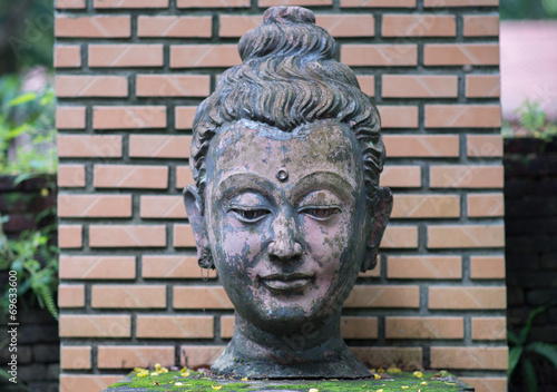 Ancient Head Buddha statue in Wat Umong at Chiangmai